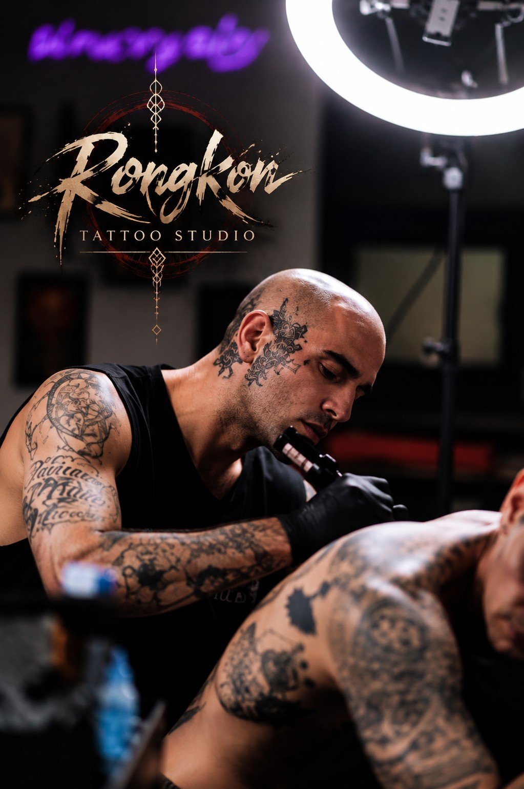 Deniz, tattoo artist at Rongkon Studio, working on a tattoo