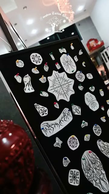 A board of original tattoo flash designs inside Rongkon Studio